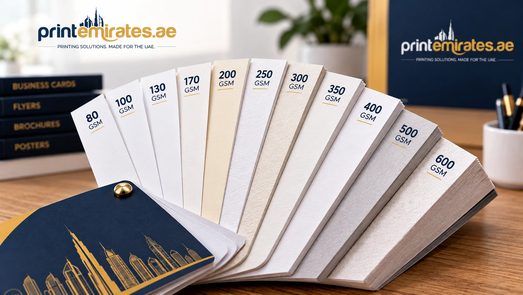 Fanned paper samples labelled from 80gsm to 600gsm showing increasing thickness