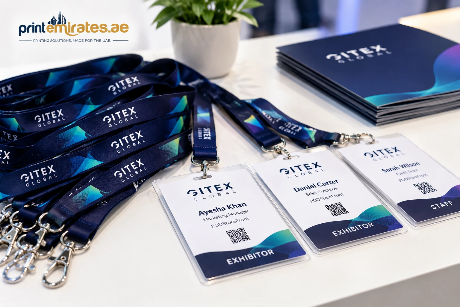 Close-up of printed lanyards and name badges laid out on a table